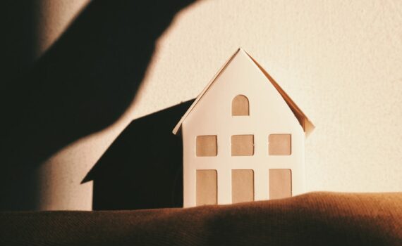 white and brown house on brown textile